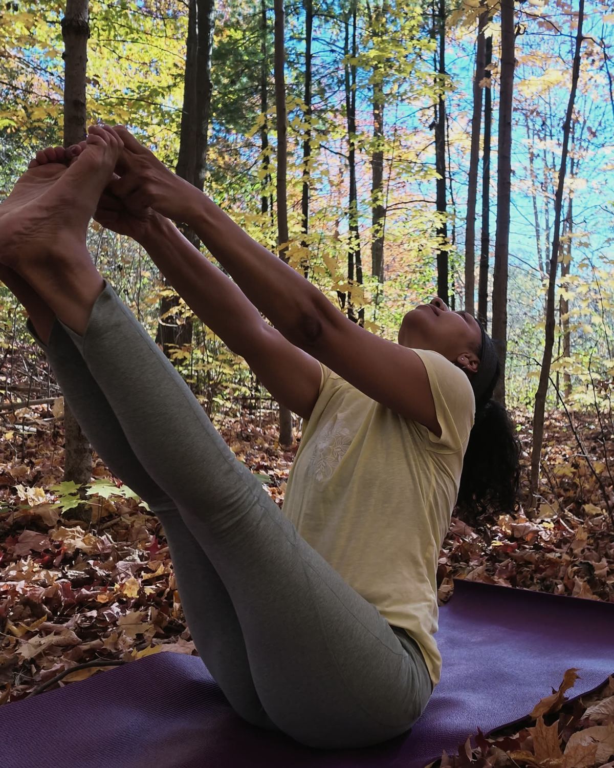 Sneh Lata holding boat pose with legs raised