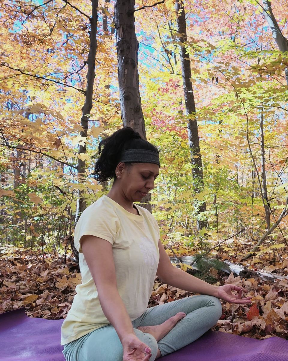 Sneh Lata seated in lotus with hands in a mudra