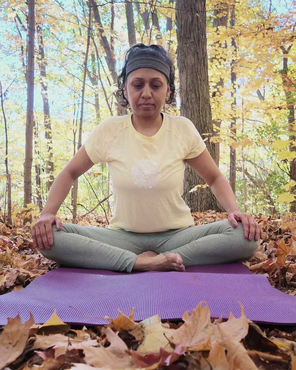 Sneh Lata seated in meditation outdoors
